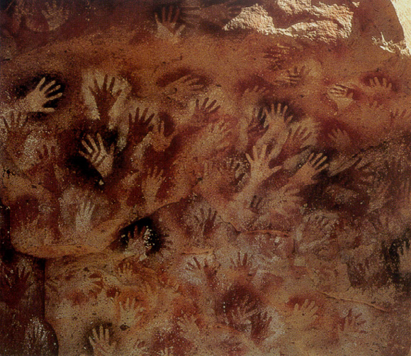 preistoria, impronte di mani nelle caverne